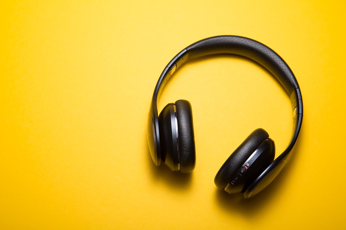 Premium wireless headphones on dark surface