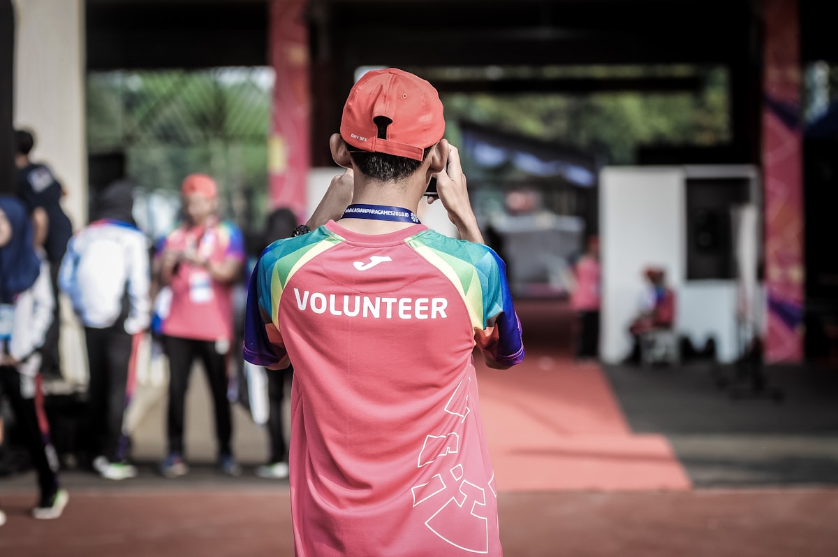 Volunteer speaking warmly with a community member at a table