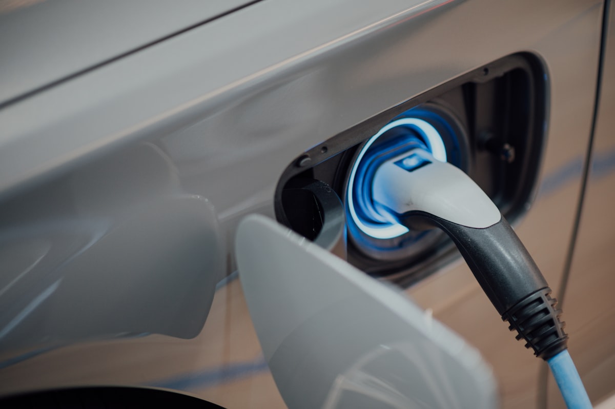 Electric vehicle home charger mounted on a garage wall